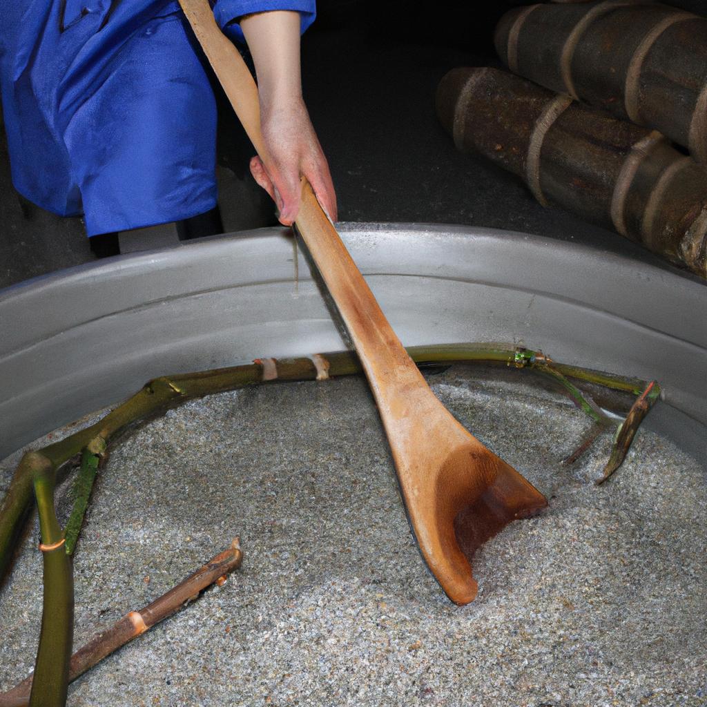Person stirring fermentation mixture, Shochu Village