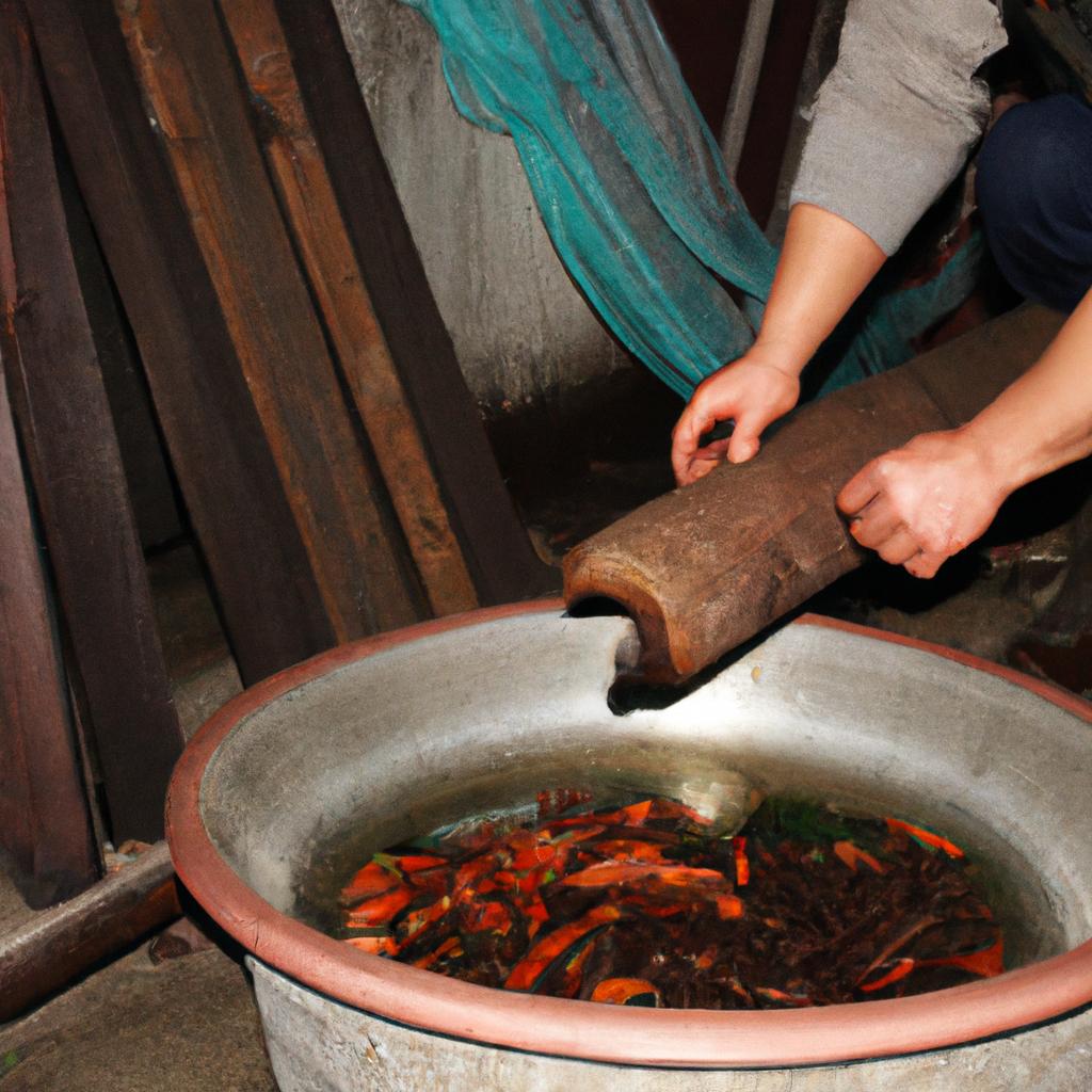 Person making shochu using traditional techniques