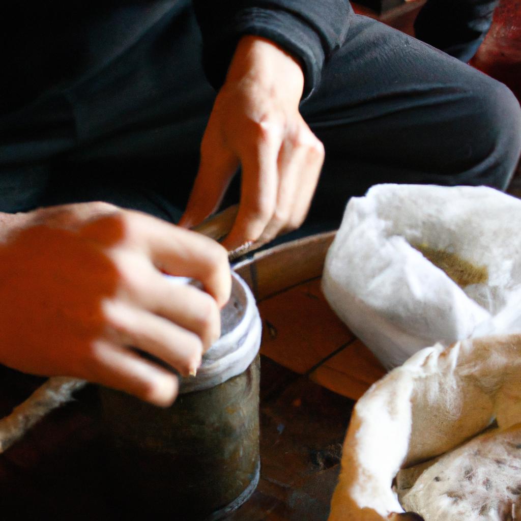 Person making shochu using traditional methods